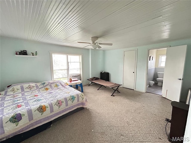 705 E Gibbs St, Salem, MO 65560 - carpeted bedroom with multiple windows, ensuite bath, a ceiling fan, and wooden ceiling