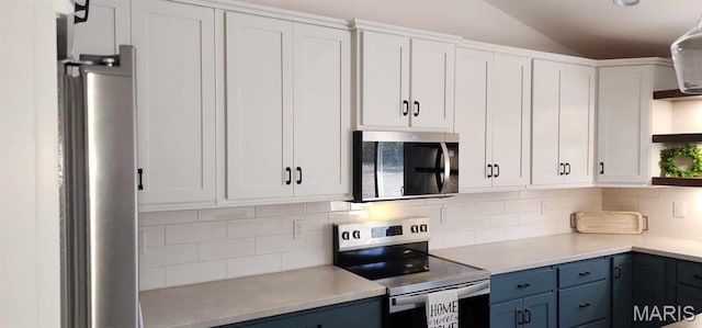 622 Scottsvale Dr, Rolla, MO 65401 - kitchen featuring stainless steel appliances, open shelves, white cabinetry, tasteful backsplash, and light countertops