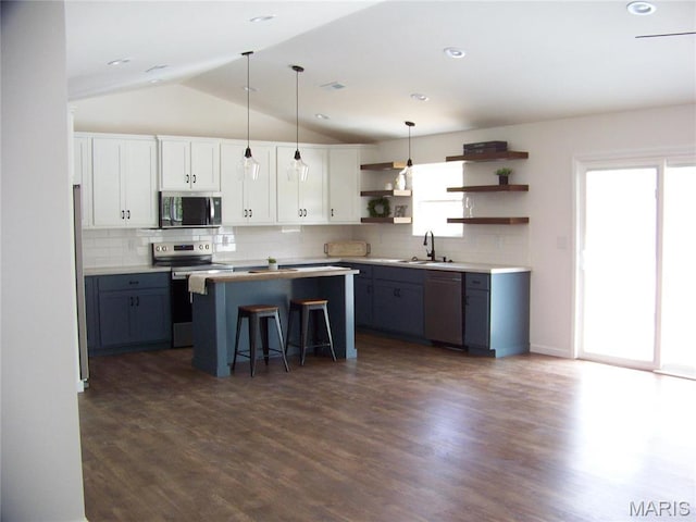 622 Scottsvale Dr, Rolla, MO 65401 - kitchen featuring stainless steel appliances, open shelves, healthy amount of natural light, a kitchen island, and lofted ceiling