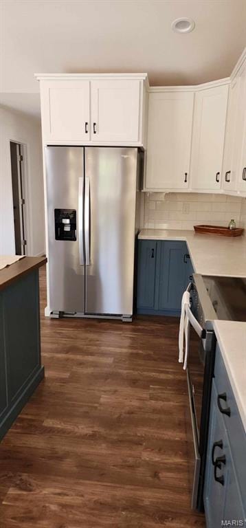 622 Scottsvale Dr, Rolla, MO 65401 - kitchen with appliances with stainless steel finishes, white cabinetry, dark wood-style floors, decorative backsplash, and recessed lighting