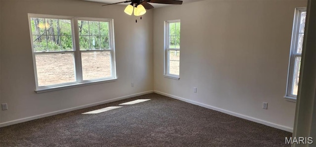 622 Scottsvale Dr, Rolla, MO 65401 - empty room featuring dark colored carpet, ceiling fan, and baseboards