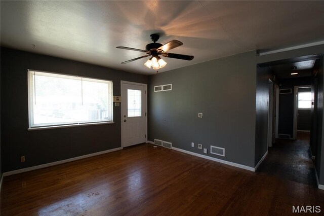 135 Dundee Cir, Saint Louis, MO 63137 - entrance foyer with wood finished floors, baseboards, a ceiling fan, and a barn door
