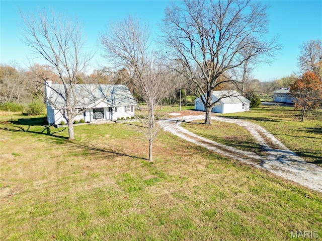 751 E Saint Eunice Rd, Fulton, MO 65251 - view of grassy yard with dirt driveway and an outdoor structure