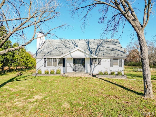 751 E Saint Eunice Rd, Fulton, MO 65251 - ranch-style house featuring a chimney, a front yard, and stucco siding