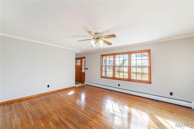 751 E Saint Eunice Rd, Fulton, MO 65251 - spare room with ornamental molding, wood finished floors, a ceiling fan, baseboards, and baseboard heating