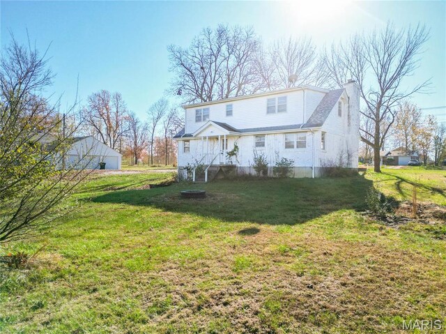 751 E Saint Eunice Rd, Fulton, MO 65251 - back of house with a chimney and a yard