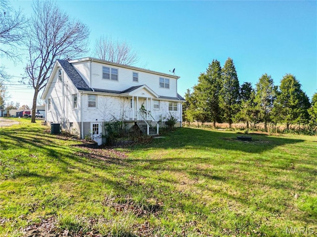751 E Saint Eunice Rd, Fulton, MO 65251 - rear view of property featuring central AC unit and a yard