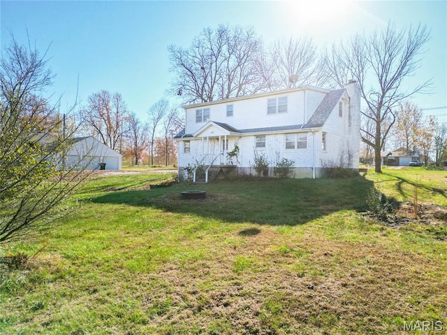 751 E Saint Eunice Rd, Fulton, MO 65251 - back of house featuring a chimney and a yard