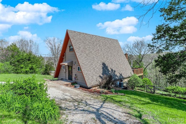 10518 Lakeview Circle Dr, Marthasville, MO 63357 - view of home's exterior with roof with shingles, a yard, and cooling unit