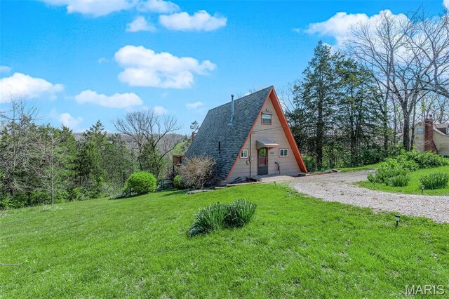 10518 Lakeview Circle Dr, Marthasville, MO 63357 - view of property exterior with a yard, roof with shingles, and driveway