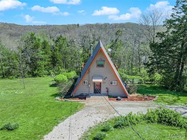 10518 Lakeview Circle Dr, Marthasville, MO 63357 - a-frame style home with a view of trees, a front yard, and driveway