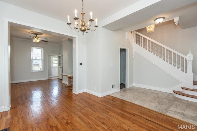 4340 Arsenal St, Saint Louis, MO 63116 - unfurnished dining area featuring a chandelier, stairway, baseboards, wood finished floors, and crown molding