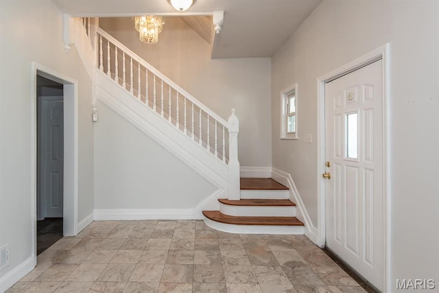 4340 Arsenal St, Saint Louis, MO 63116 - foyer featuring stairway, a chandelier, and baseboards