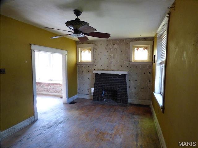 5086 Arlington Ave, Saint Louis, MO 63120 - unfurnished living room with baseboards, wood finished floors, a ceiling fan, and a fireplace
