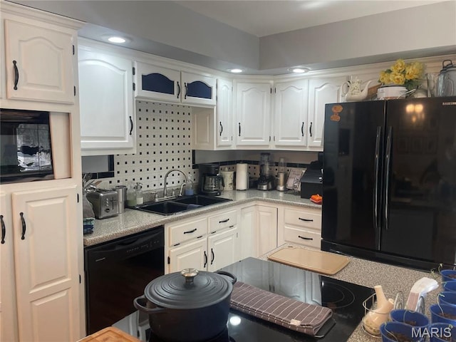 4101 Juedeman Rd, Mo, MO 65453 - kitchen with black appliances, a sink, white cabinetry, and light countertops