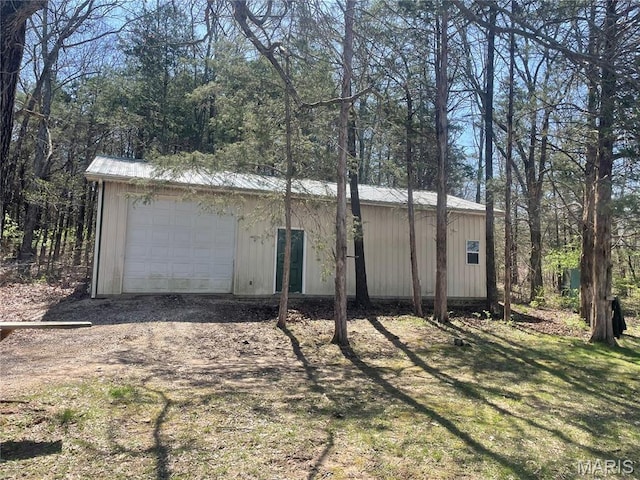 4101 Juedeman Rd, Mo, MO 65453 - view of side of home featuring an outbuilding, metal roof, and a detached garage