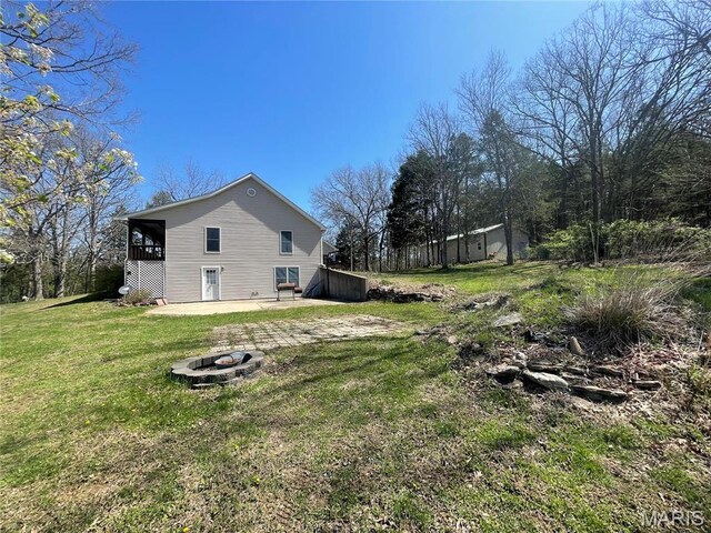 4101 Juedeman Rd, Mo, MO 65453 - view of green lawn featuring an outdoor fire pit