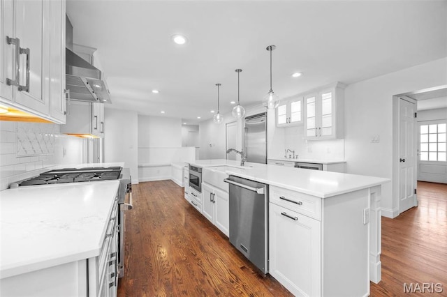 1304 Brynnwood Dr, Saint Louis, MO 63124 - kitchen featuring built in appliances, a sink, dark wood finished floors, decorative backsplash, and recessed lighting