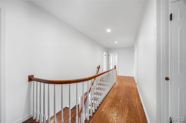 1304 Brynnwood Dr, Saint Louis, MO 63124 - hallway featuring an upstairs landing, wood finished floors, recessed lighting, and baseboards