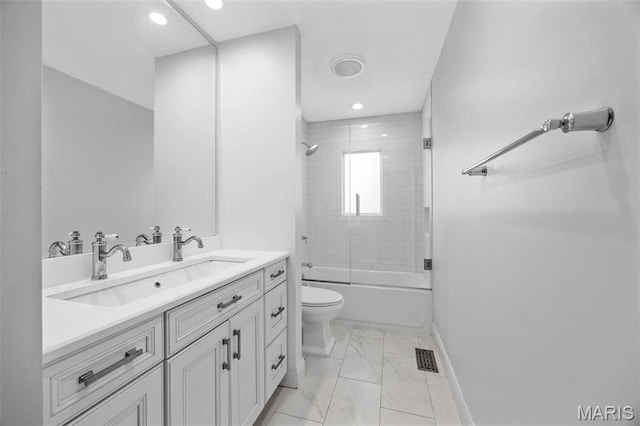 1304 Brynnwood Dr, Saint Louis, MO 63124 - full bath featuring marble look tiles, baseboards, toilet, combined bath / shower with glass door, and vanity