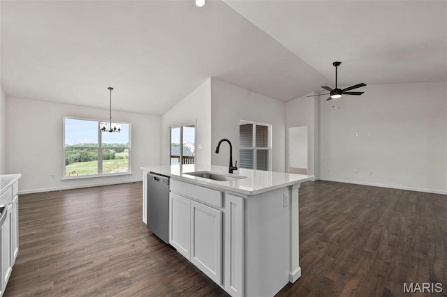 kitchen with a sink, dishwasher, vaulted ceiling, open floor plan, and a chandelier
