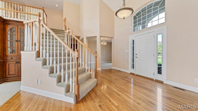 9108 Wiltshire Dr, Columbia, IL 62236 - foyer with wood finished floors, stairs, baseboards, and a towering ceiling