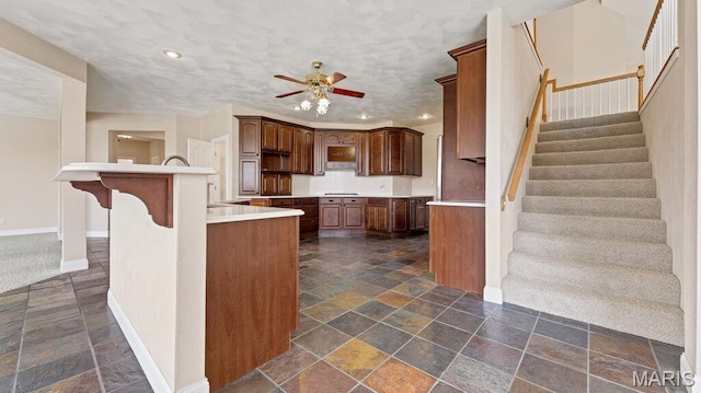 9108 Wiltshire Dr, Columbia, IL 62236 - kitchen featuring stone tile floors, ceiling fan, baseboards, recessed lighting, and light countertops