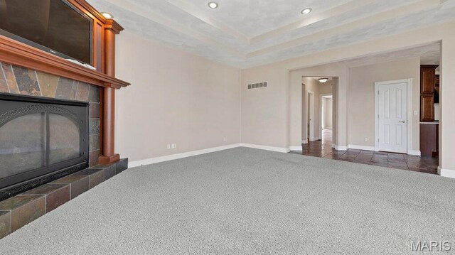 9108 Wiltshire Dr, Columbia, IL 62236 - unfurnished living room featuring dark colored carpet, recessed lighting, baseboards, and a tiled fireplace