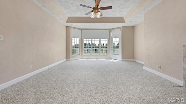 9108 Wiltshire Dr, Columbia, IL 62236 - carpeted spare room featuring a raised ceiling, baseboards, and ceiling fan