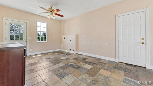 9108 Wiltshire Dr, Columbia, IL 62236 - laundry area featuring stone tile flooring, ceiling fan, baseboards, hookup for an electric dryer, and cabinet space