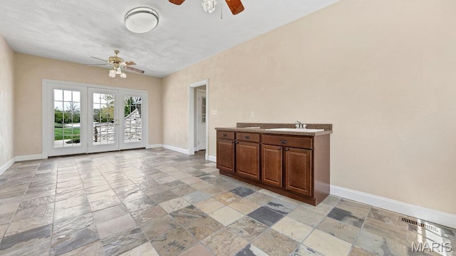 9108 Wiltshire Dr, Columbia, IL 62236 - interior space with ceiling fan, stone tile flooring, and baseboards