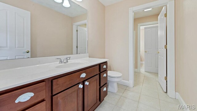 9108 Wiltshire Dr, Columbia, IL 62236 - bathroom with tile patterned floors, toilet, vanity, and baseboards