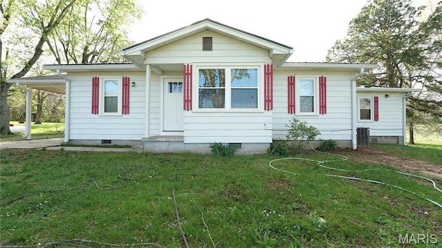 back of property featuring crawl space, a yard, central air condition unit, and entry steps
