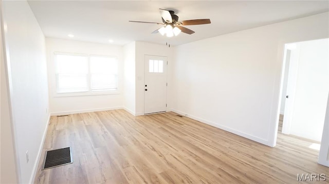 unfurnished room featuring light wood-style floors, a ceiling fan, baseboards, and recessed lighting