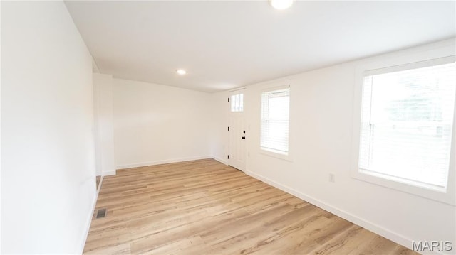unfurnished room featuring light wood-style floors, baseboards, and recessed lighting