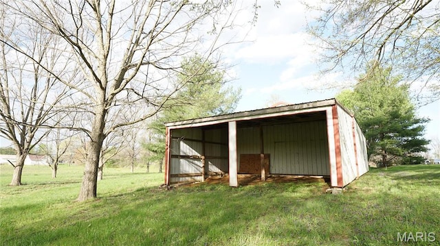 view of pole building with a yard