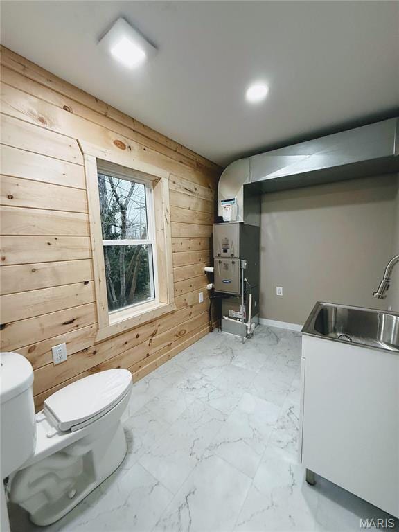 120 W Caldwell, La Plata, MO 63549 - bathroom featuring wood walls, marble finish floors, and recessed lighting