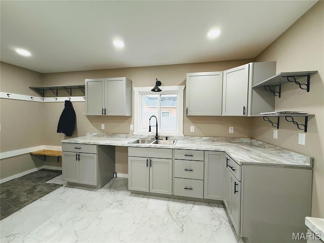 120 W Caldwell, La Plata, MO 63549 - kitchen featuring open shelves, light countertops, recessed lighting, light marble finish floors, and gray cabinetry