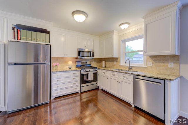 5 W Sunny Hill Blvd, Saint Peters, MO 63376 - kitchen featuring stainless steel appliances, a sink, white cabinetry, dark wood-type flooring, and light stone countertops