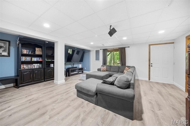 5 Cedar Fork Ct, Defiance, MO 63341 - living room featuring wood finished floors, a paneled ceiling, and baseboards