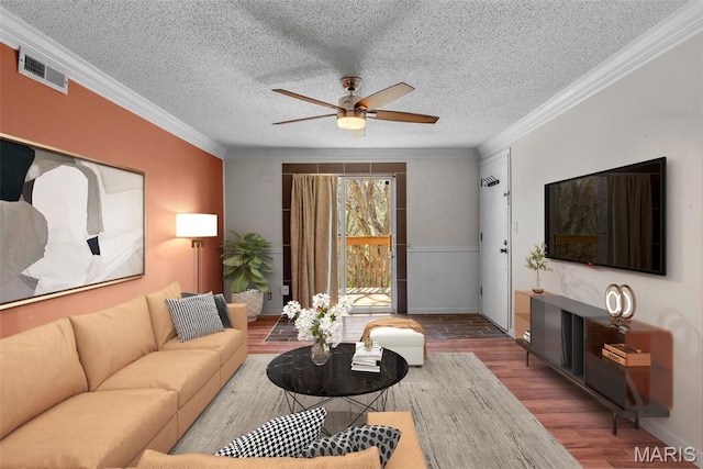 2793 Blackforest Dr Unit B, Saint Louis, MO 63129 - living room featuring wood finished floors, ornamental molding, ceiling fan, a textured ceiling, and baseboards