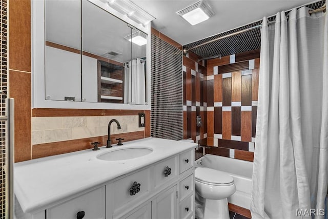 2793 Blackforest Dr Unit B, Saint Louis, MO 63129 - bathroom featuring tile walls, toilet, vanity, shower / bathtub combination with curtain, and backsplash