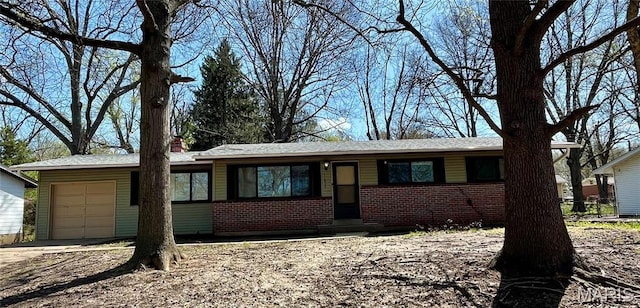 11606 Herefordshire Dr, Saint Louis, MO 63138 - ranch-style house with an attached garage, brick siding, driveway, and a chimney
