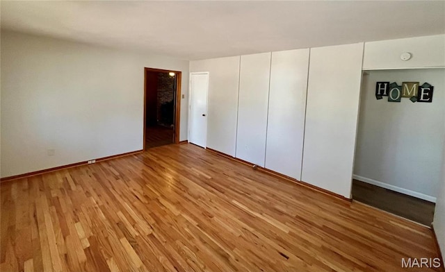 11606 Herefordshire Dr, Saint Louis, MO 63138 - unfurnished bedroom featuring light wood-style floors and baseboards
