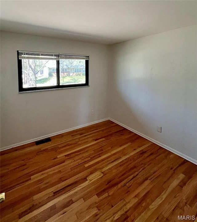 11606 Herefordshire Dr, Saint Louis, MO 63138 - empty room featuring wood finished floors and baseboards