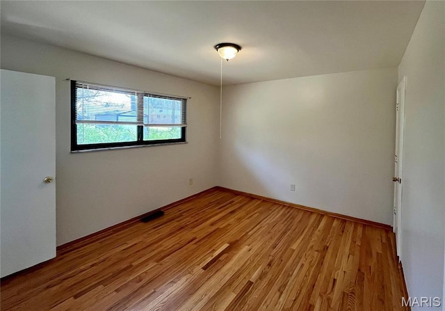 11606 Herefordshire Dr, Saint Louis, MO 63138 - unfurnished room featuring light wood-style flooring and baseboards