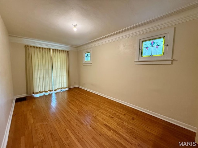 6542 Cedar Hill Rd, Cedar Hill, MO 63016 - spare room featuring ornamental molding, plenty of natural light, baseboards, and wood finished floors