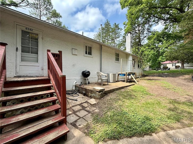 6542 Cedar Hill Rd, Cedar Hill, MO 63016 - rear view of house featuring central AC and stucco siding