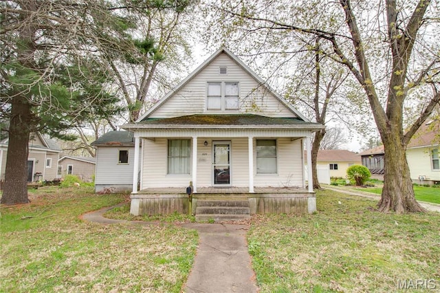 225 Tunison, White Hall, IL 62092 - bungalow-style home with a porch and a front lawn