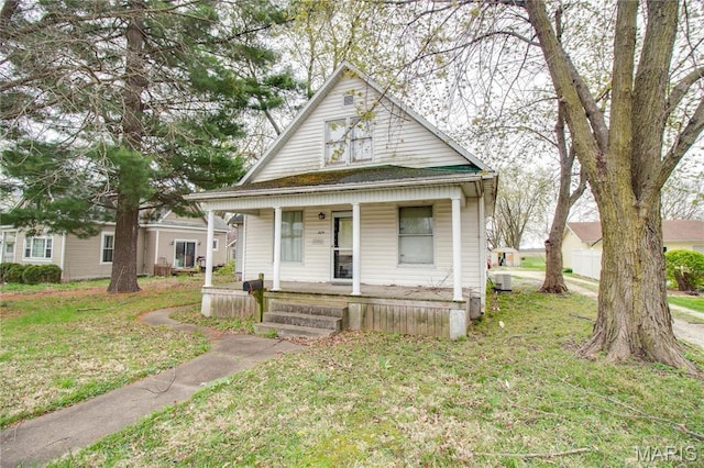 225 Tunison, White Hall, IL 62092 - view of front of house featuring covered porch and a front yard